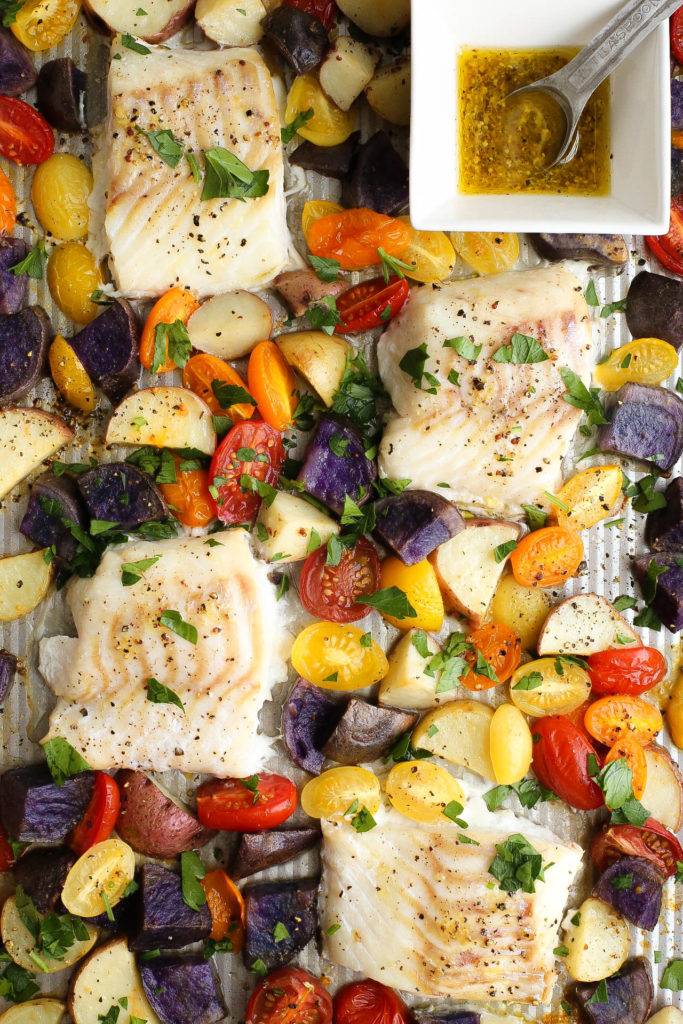 Cod and baked vegetables on a baking sheet