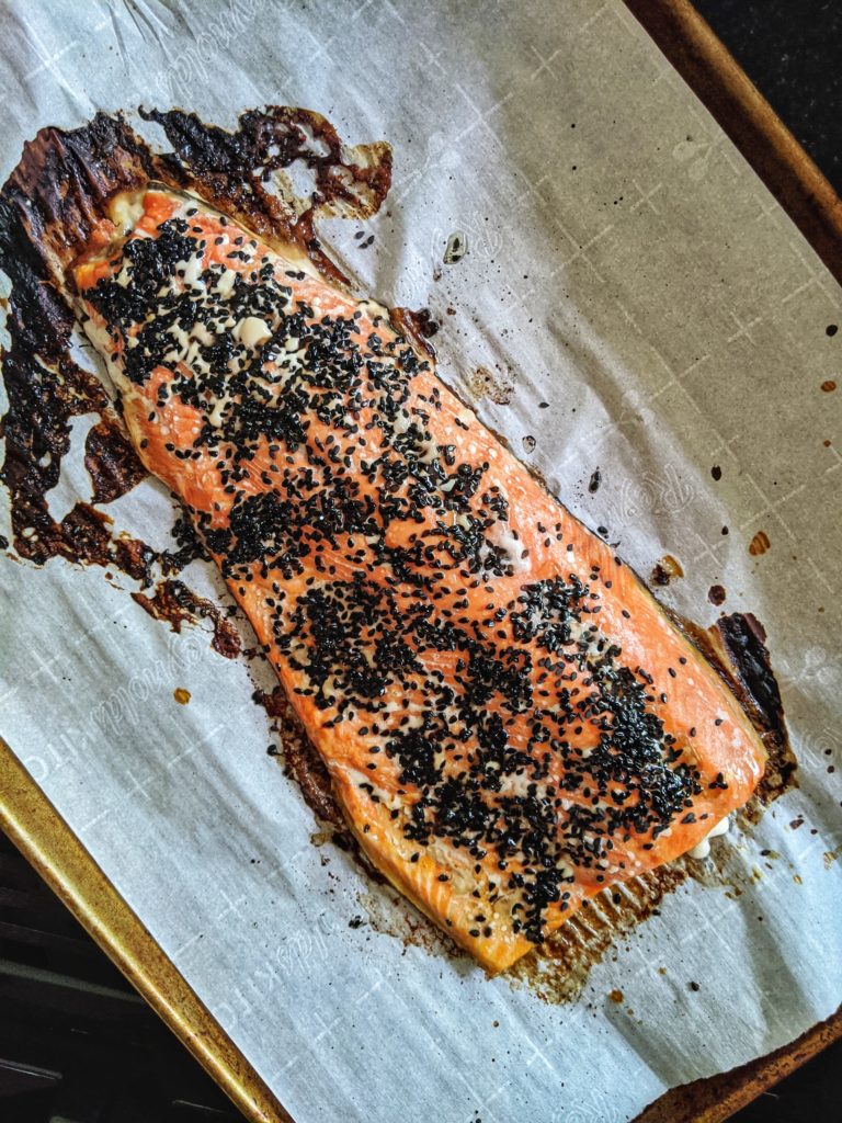 Baked salmon fillet on a baking sheet